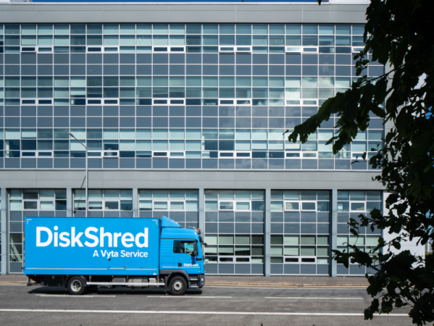 A specialised shredding truck travelling to a business to perform on site hard drive shredding