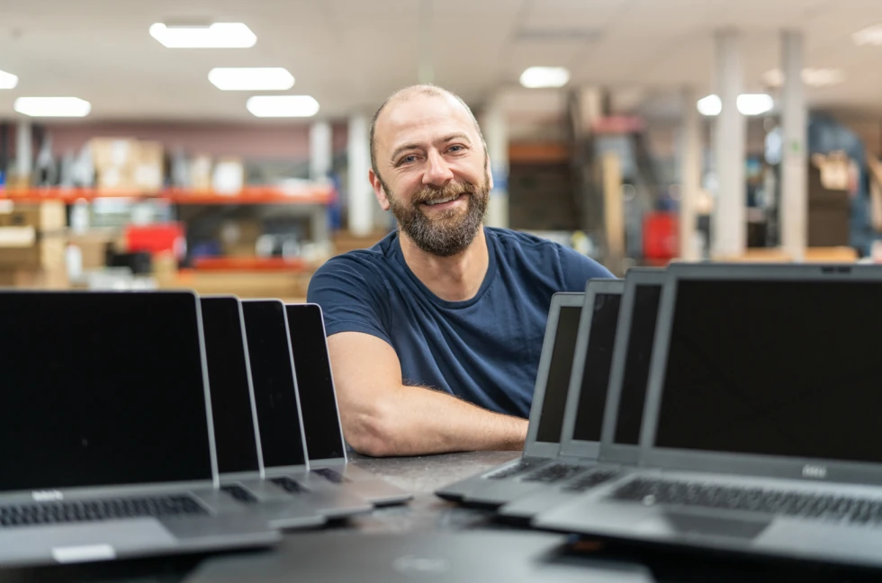 Chief Executive Officer of Vyta, Philip McMichael behind some laptops