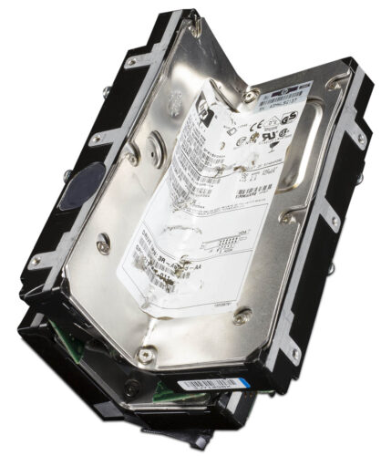 A hard drive with a noticeable bend, symbolising hard drive crushing for data destruction